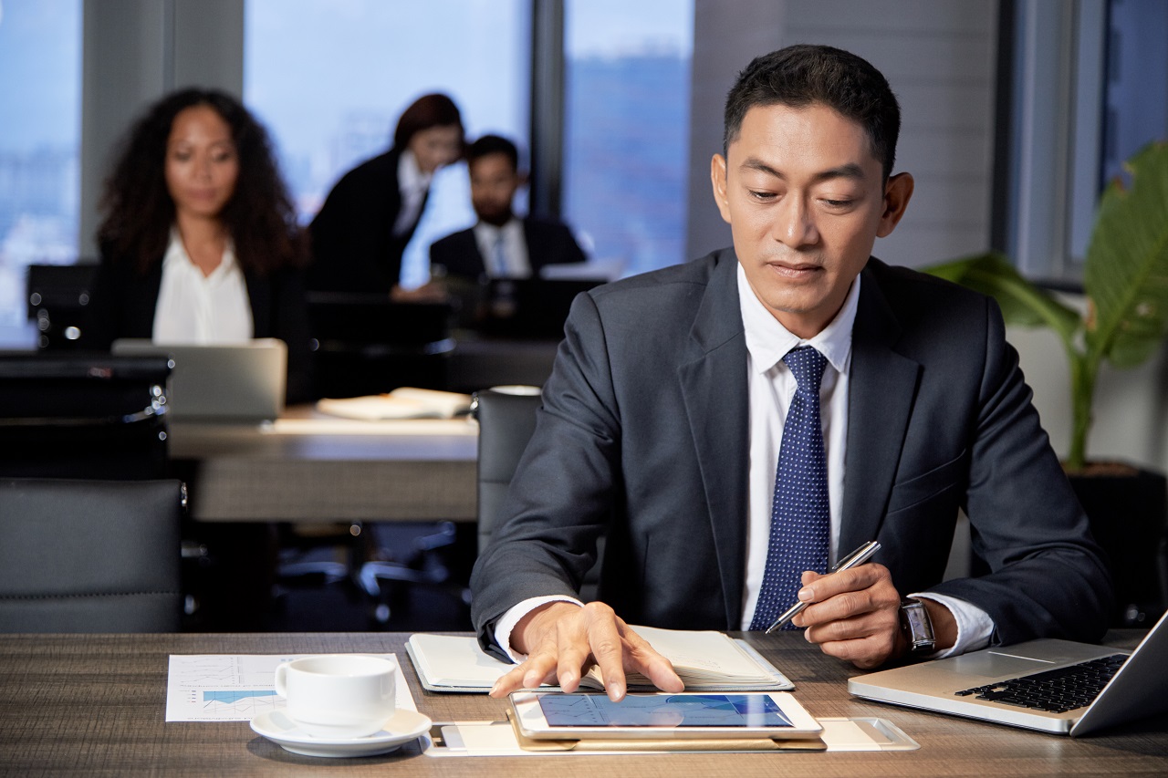 A businessman working in his office in an industrial park