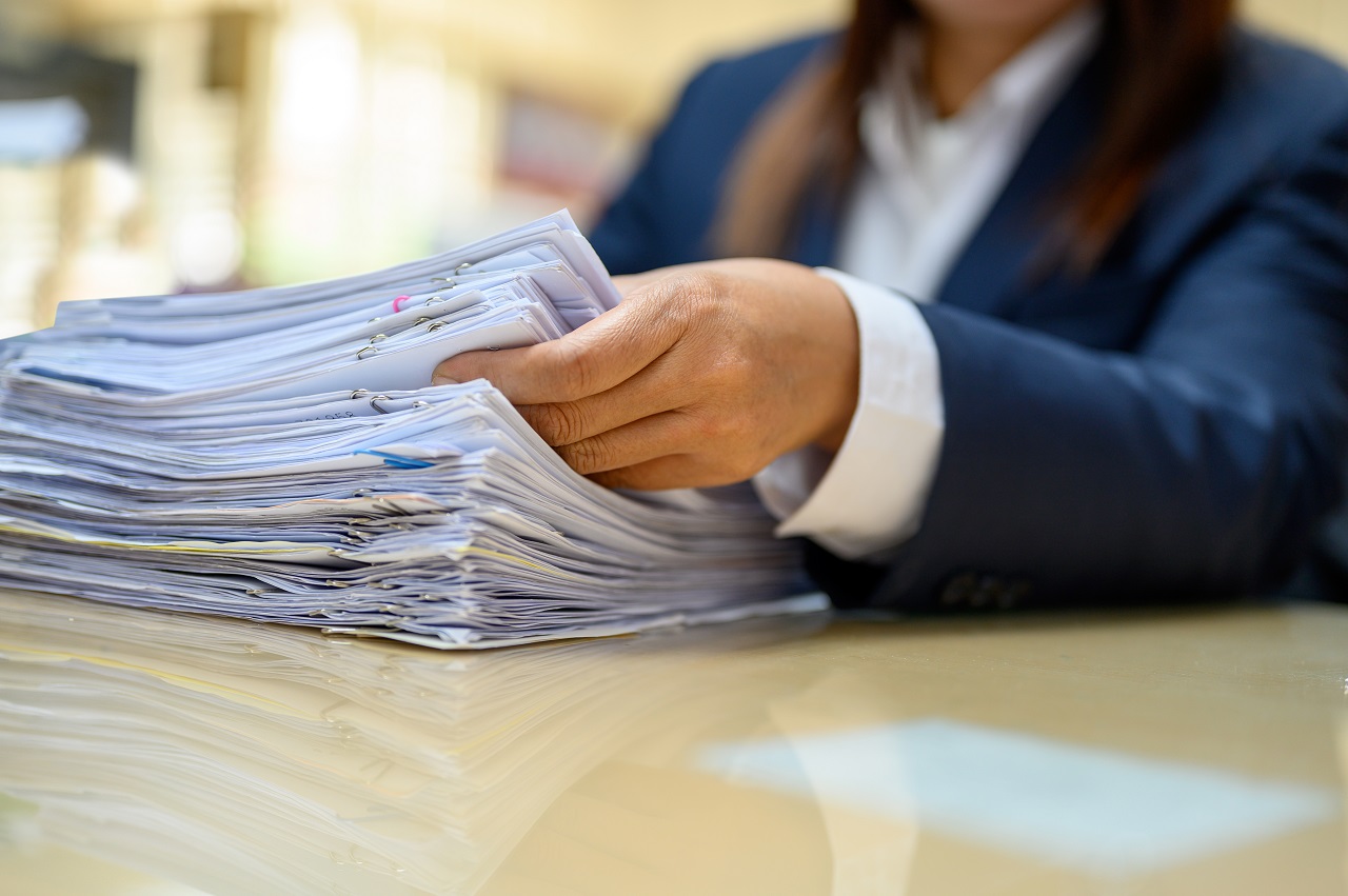 A woman handling government paperwork