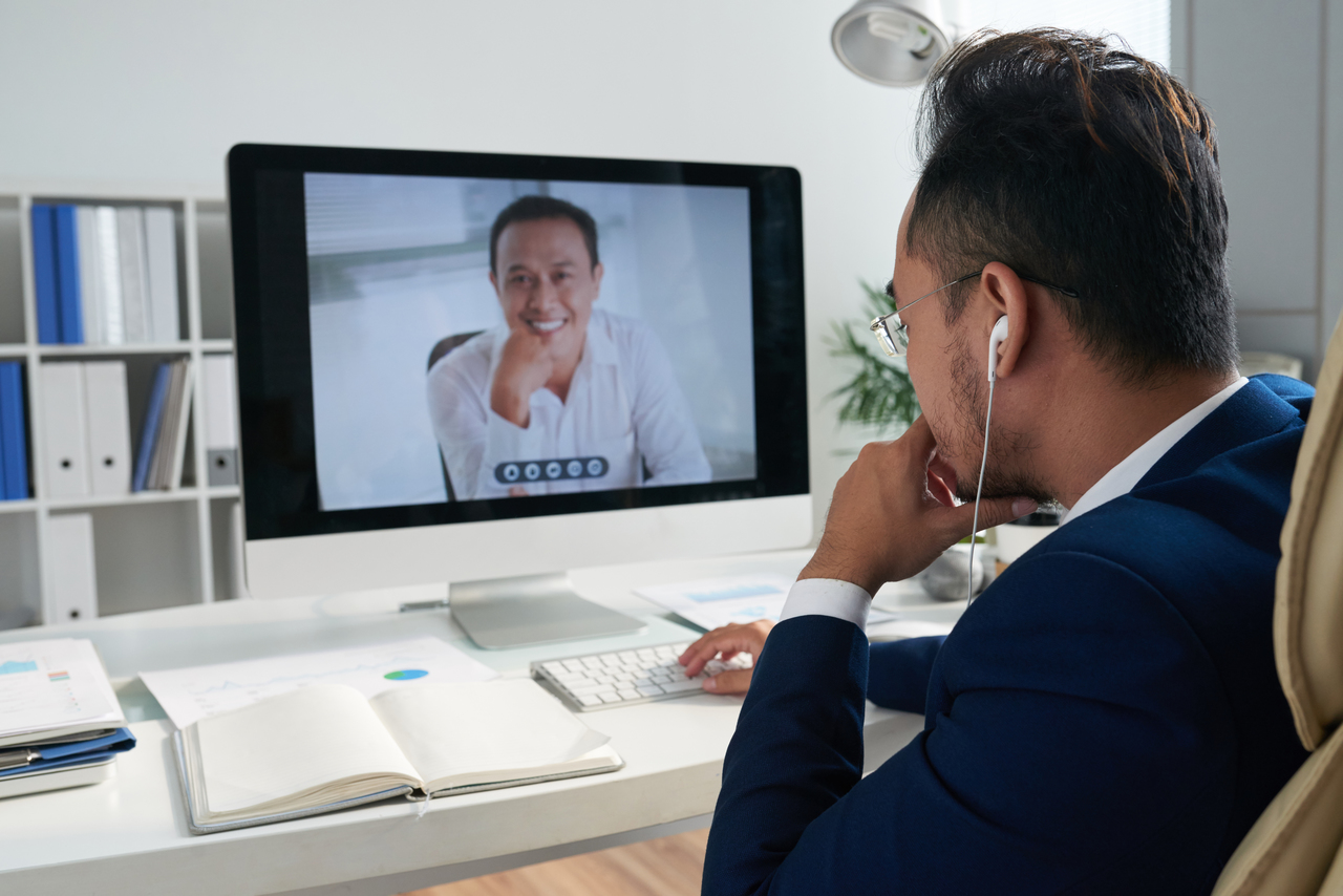 A man having an online meeting