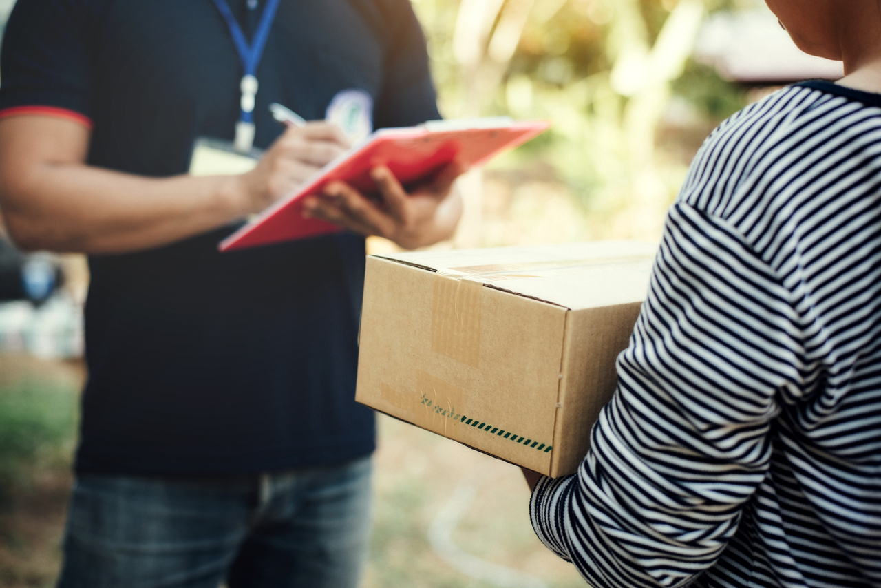 A man delivering an e-commerce package