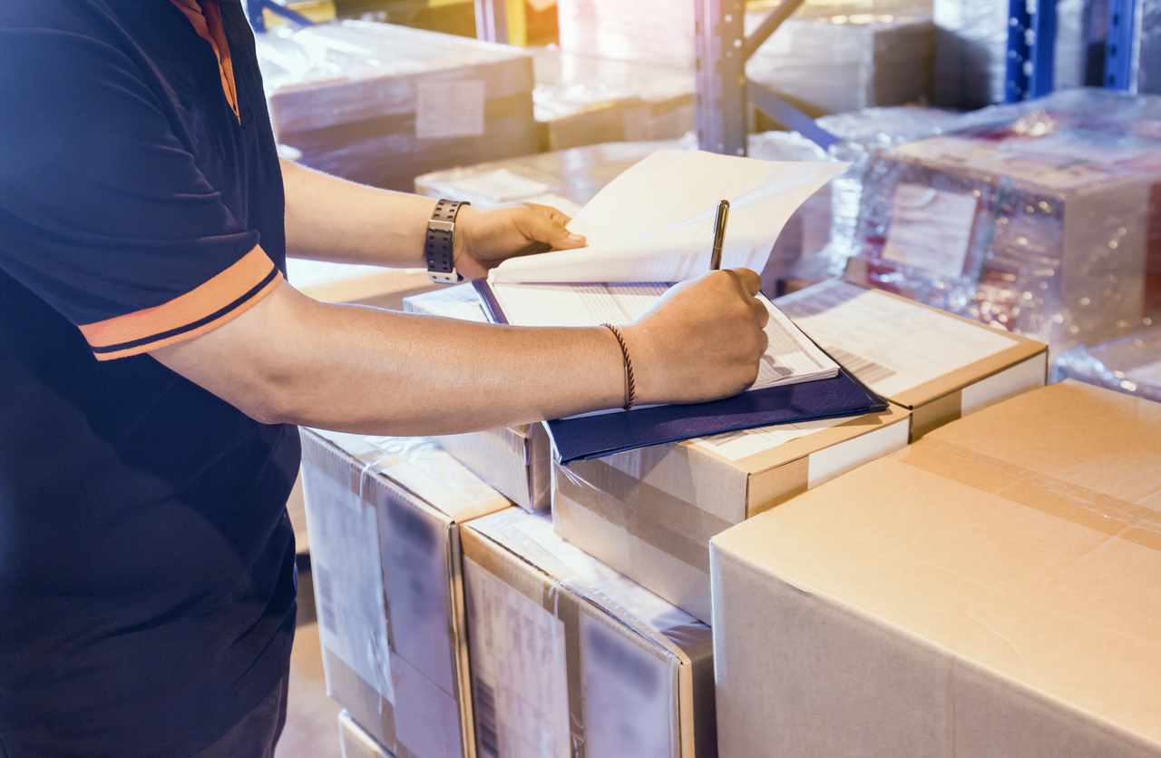 A man taking note of inventory